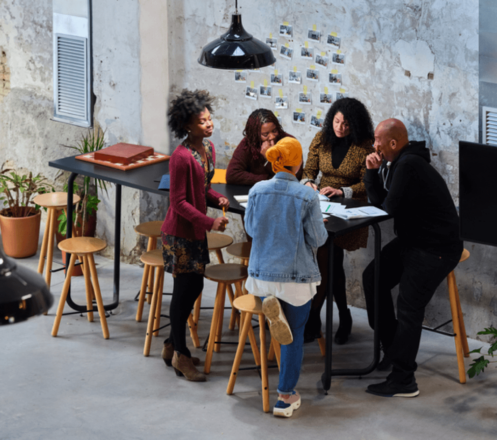 Group of people discussing work in an office